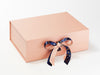 Example of Navy Sparkle Bee Recycled Satin Ribbon Featured As A Double Bow on Rose Gold Gift Box