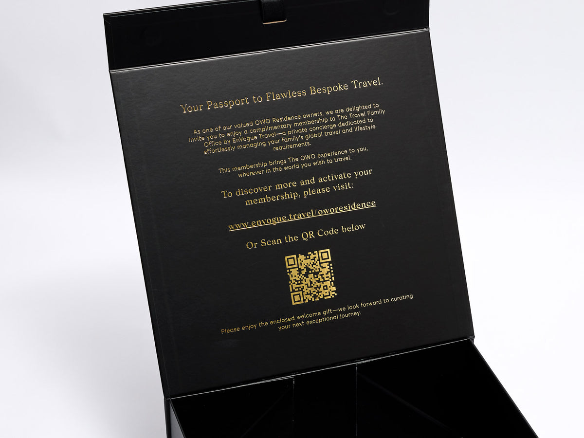Black box with gold foiled text and QR code on a white background
