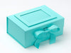 Turquoise gift box with a ribbon on a white background