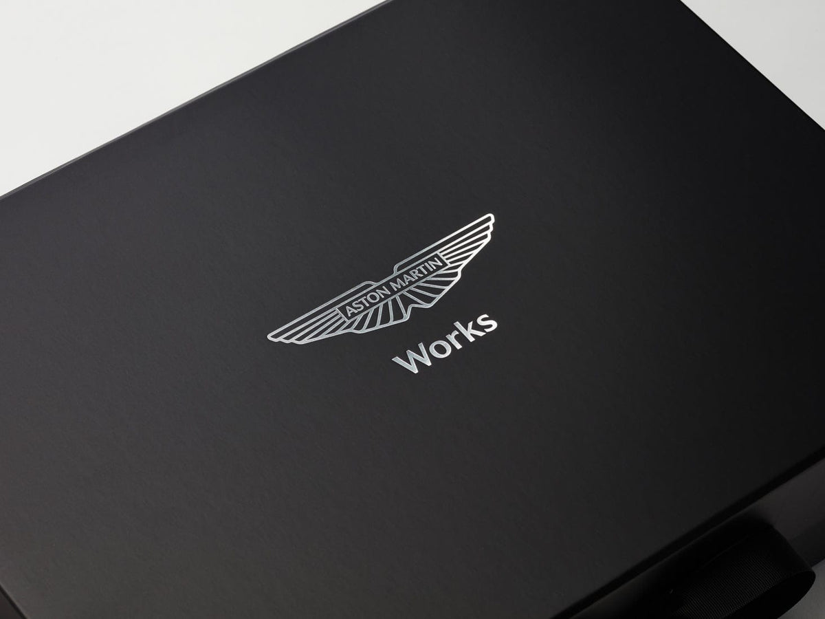 Aston Martin logo on a black gift box