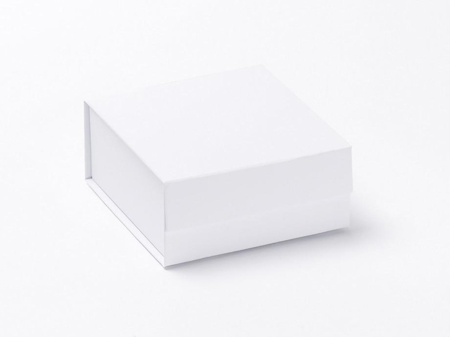 Small white magnetic snap shut folding gift box