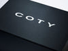 Black Folding Gift Box with Custom Printed White Coty Logo to Lid
