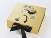 Gold Gift Box Featuring Black Custom Foil Logo and Black Ribbon
