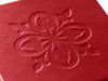 Custom Debossed logo onto lid of red folding gift box