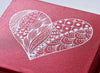 Red folding gift box with custom white foil heart logo to lid