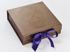 Example of Regal Purple Ribbon Featured on Bronze Gift Box with Custom Debossed Design on Lid